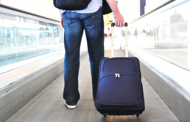 Airport passenger with luggage