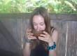 Rhian drinking yuca in the Ecuadorian Amazon