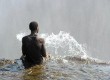 Sitting on the edge of Victoria Falls (photo: Natasha von Geldern)